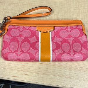 Coach pink & orange wristlet slightly used